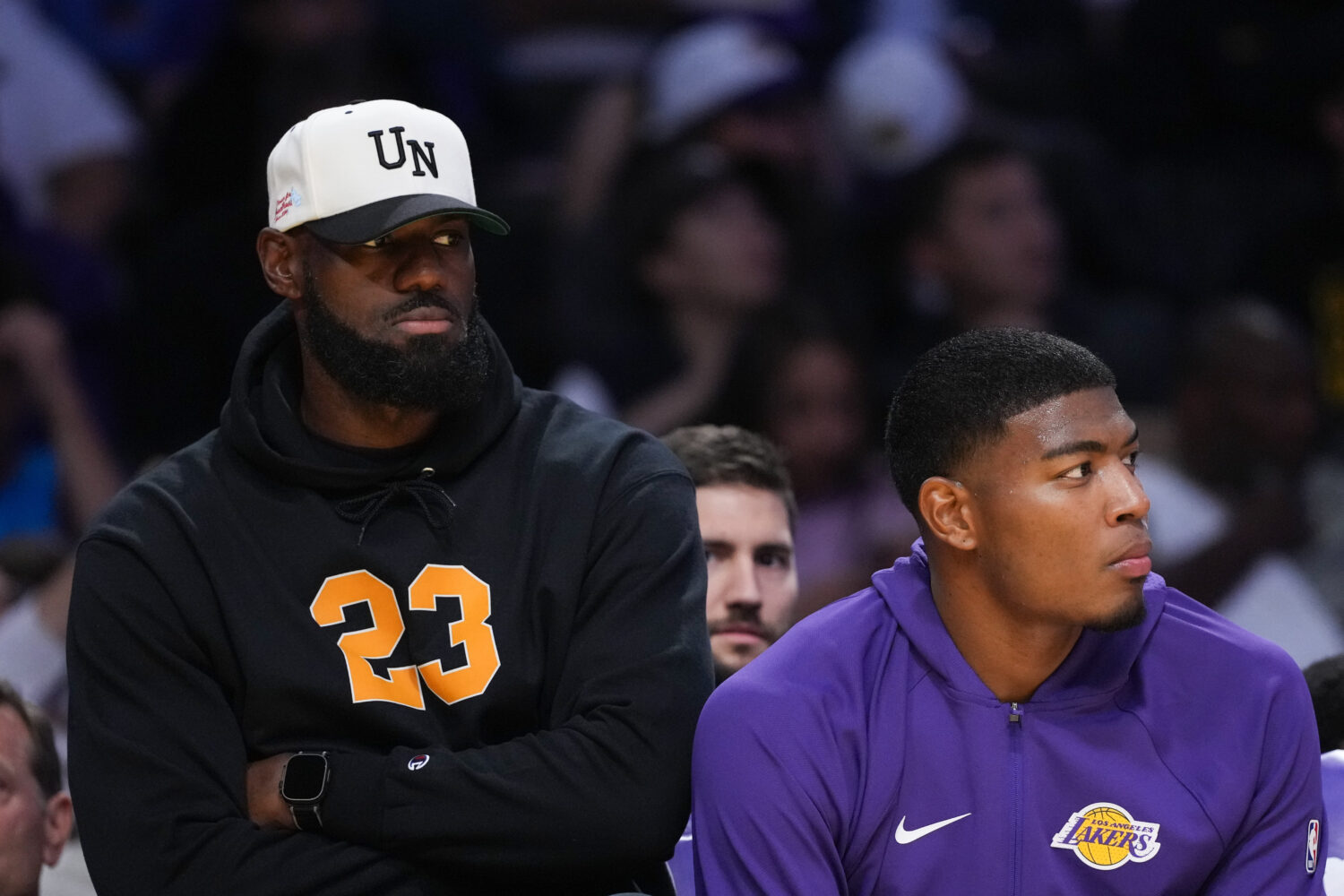Los Angeles Lakers' Lebron James, left, and Rui Hachimura watch action from the bench during the fi...