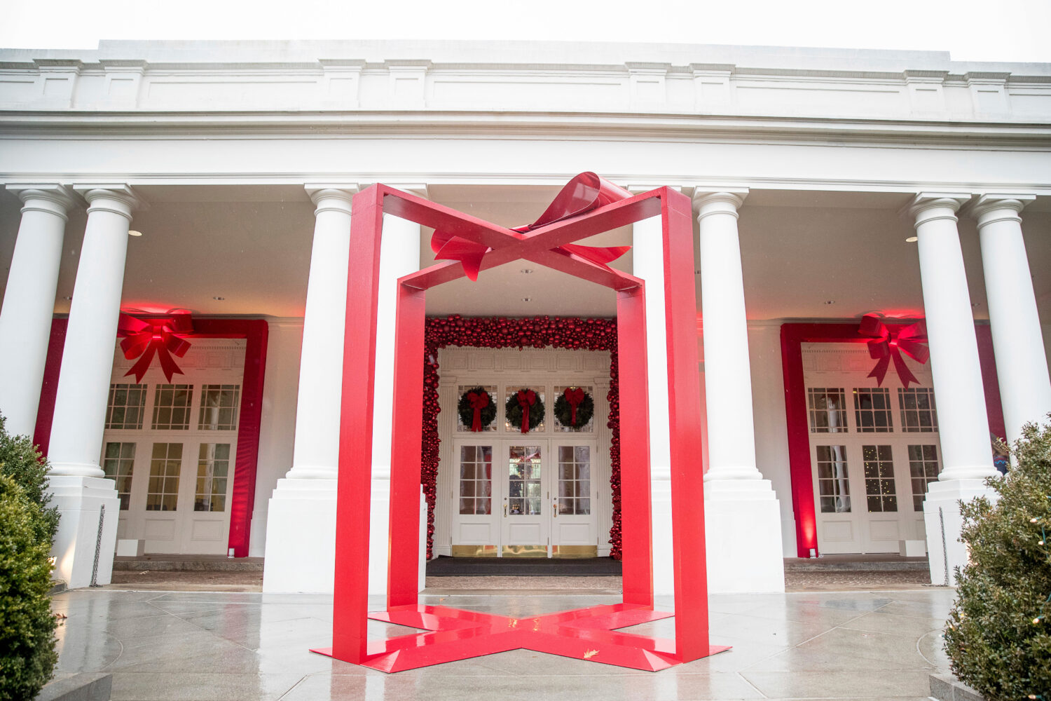 FILE - A large ribbon is displayed outside the East Wing of the White House during a preview of the...