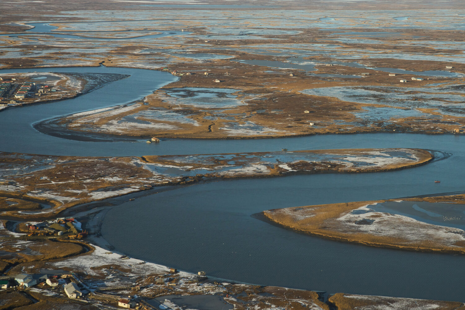 Some homes and buildings that were torn off their foundations and floated away are seen near the vi...