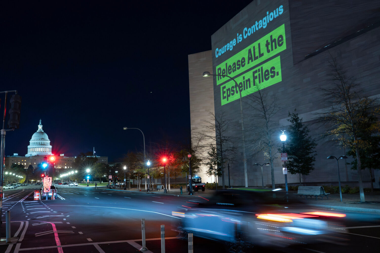 A World Without Exploitation projection is seen on the wall of the National Gallery of Art calling ...