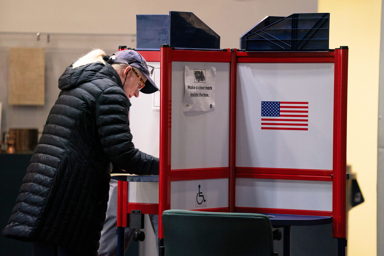 A voter completes her ballot at Alexandria City Hall, Tuesday, Nov. 4, 2025, in Alexandria, Va. (AP...