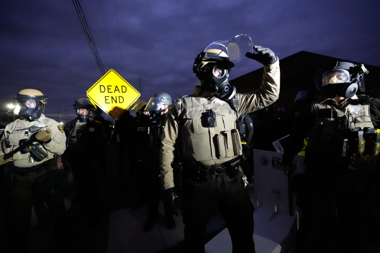 Law enforcement standoff with protesters outside an ICE processing facility in the Chicago suburb o...