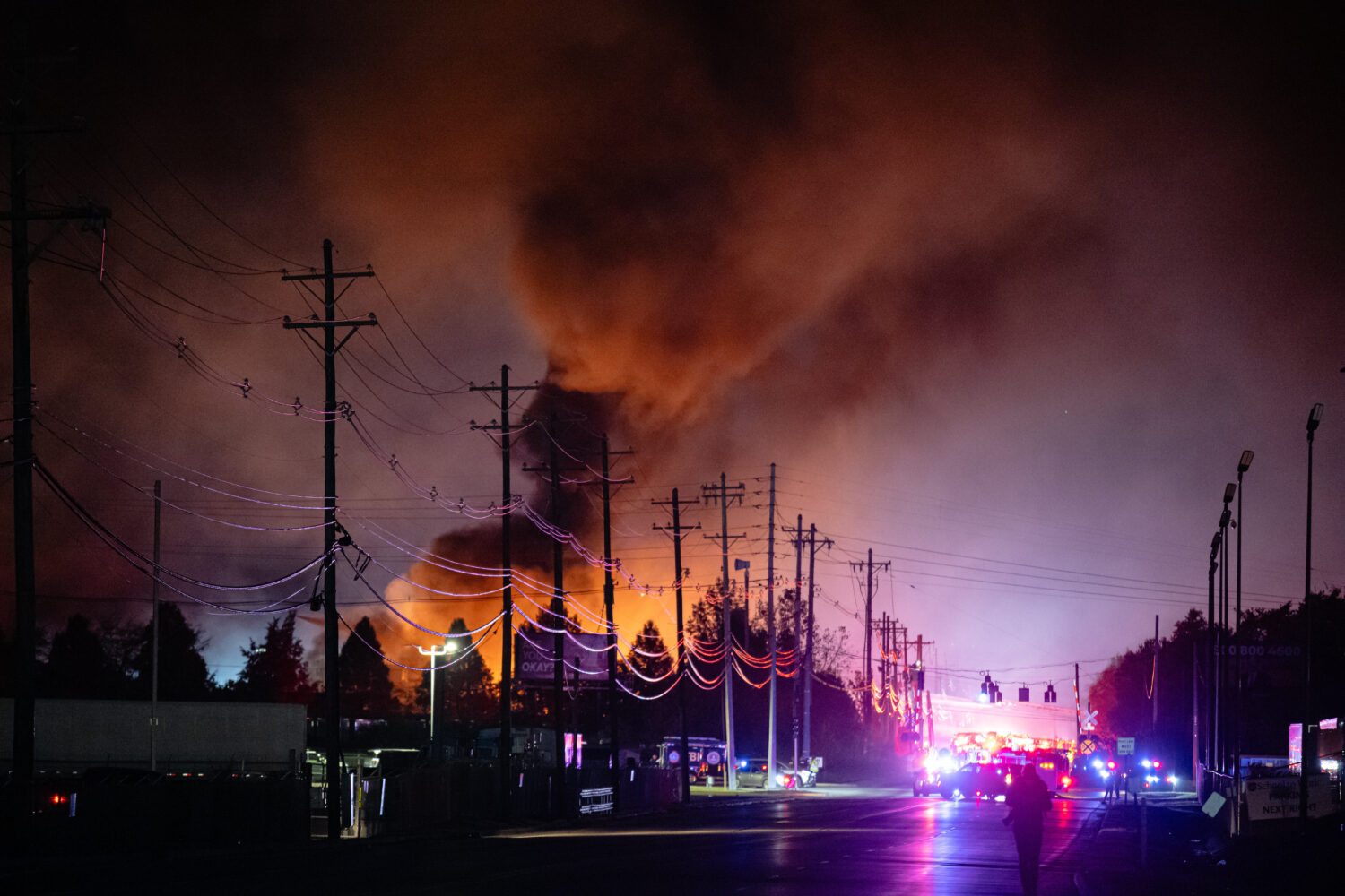 Plumes of smoke rise from the area of a UPS cargo plane crash at Louisville Muhammad Ali Internatio...