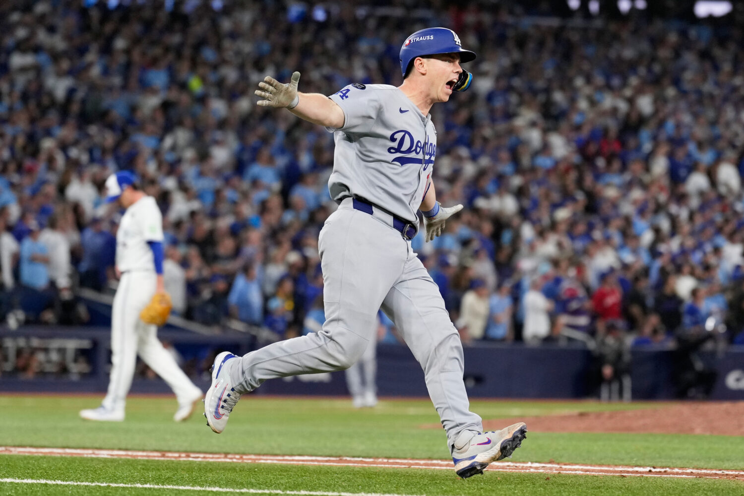 Los Angeles Dodgers' Will Smith celebrates a home run against the Toronto Blue Jays during the11th ...