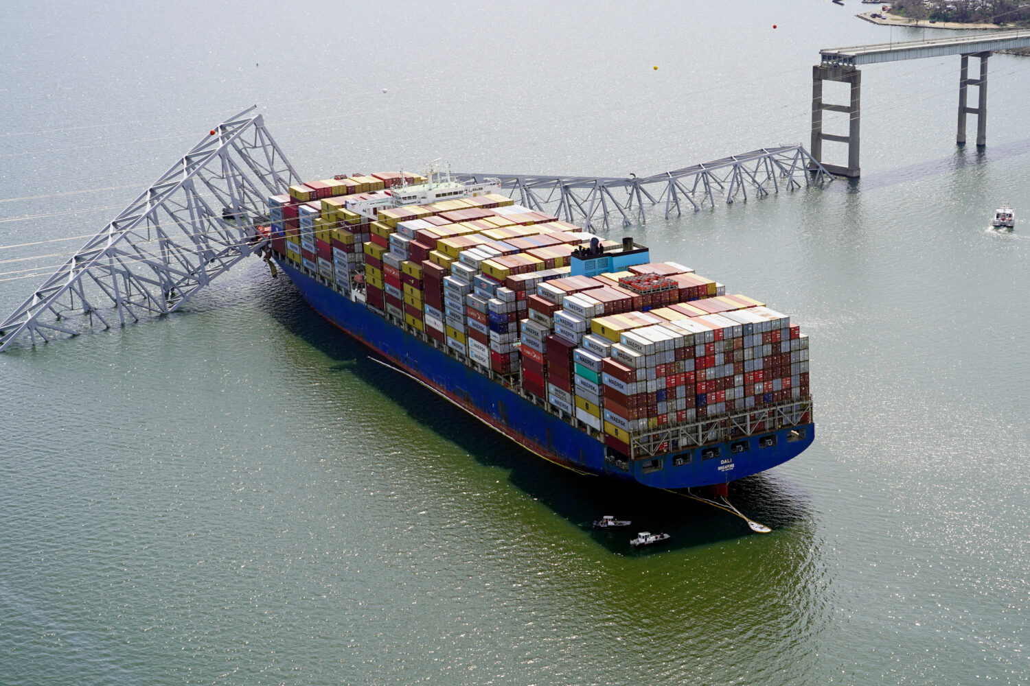 FILE - In this photo provided by the Maryland National Guard, the cargo ship Dali is stuck under pa...