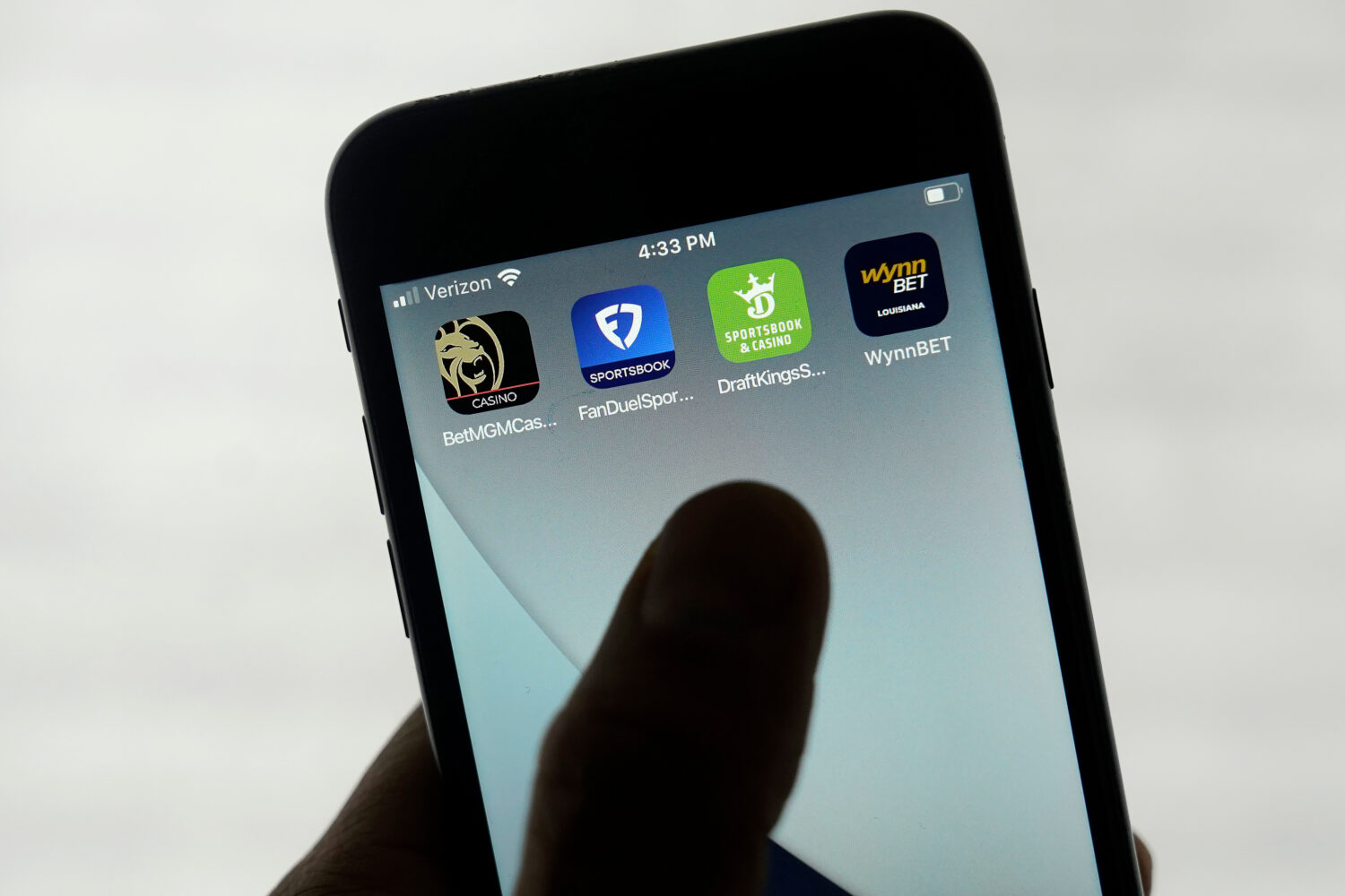 FILE - FanDuel, DraftKings and other online gambling apps are displayed on a phone in San Francisco...