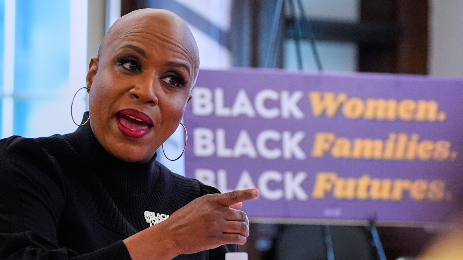 U.S. Rep. Ayanna Pressley, D-Mass. gestures while addressing a gathering at a roundtable meeting, M...