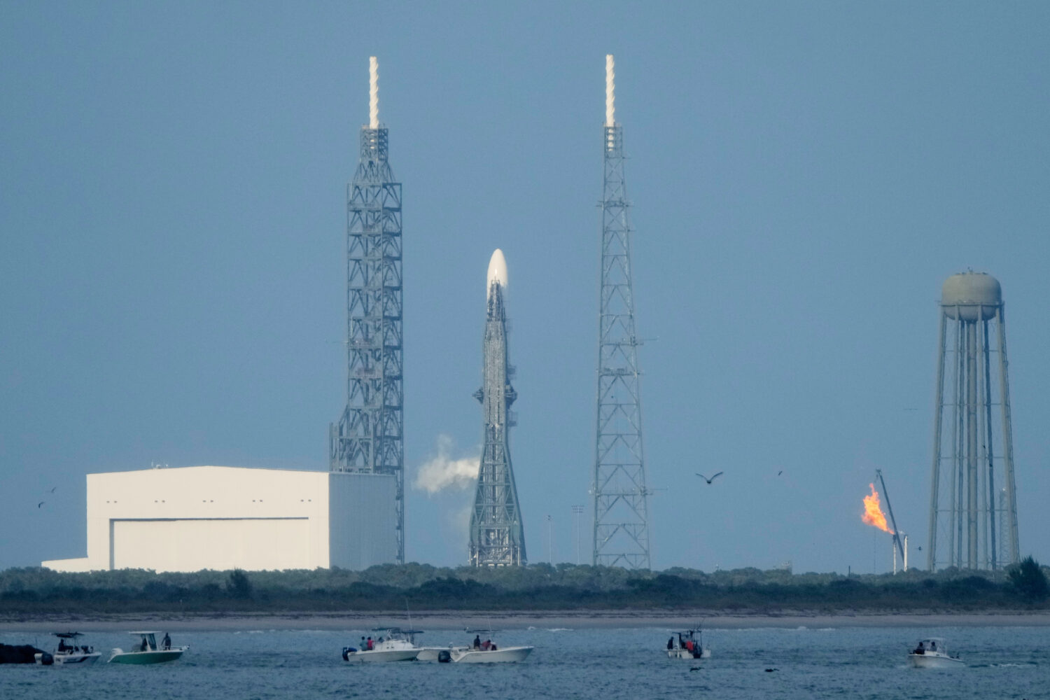 A Blue Origin New Glenn rocket stands ready on Launch Complex 36 a few minutes before the launch wa...