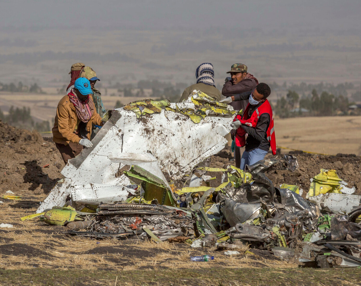 FILE - In this March 11, 2019, file photo, rescuers work at the scene of an Ethiopian Airlines flig...