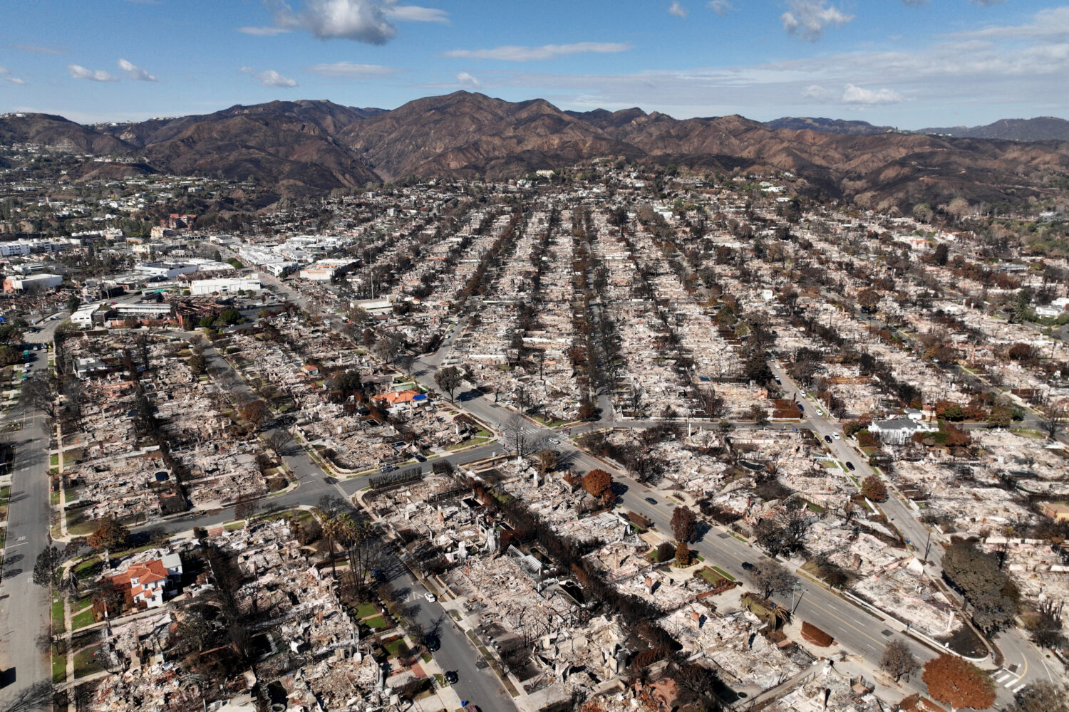 FILE - The devastation from the Palisades Fire is shown in an aerial view in the Pacific Palisades ...