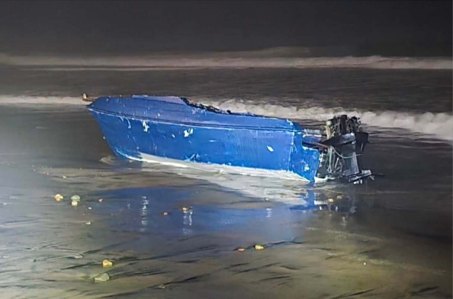 This photo provided by the Defense Visual Information Distribution Service shows a capsized boat on...