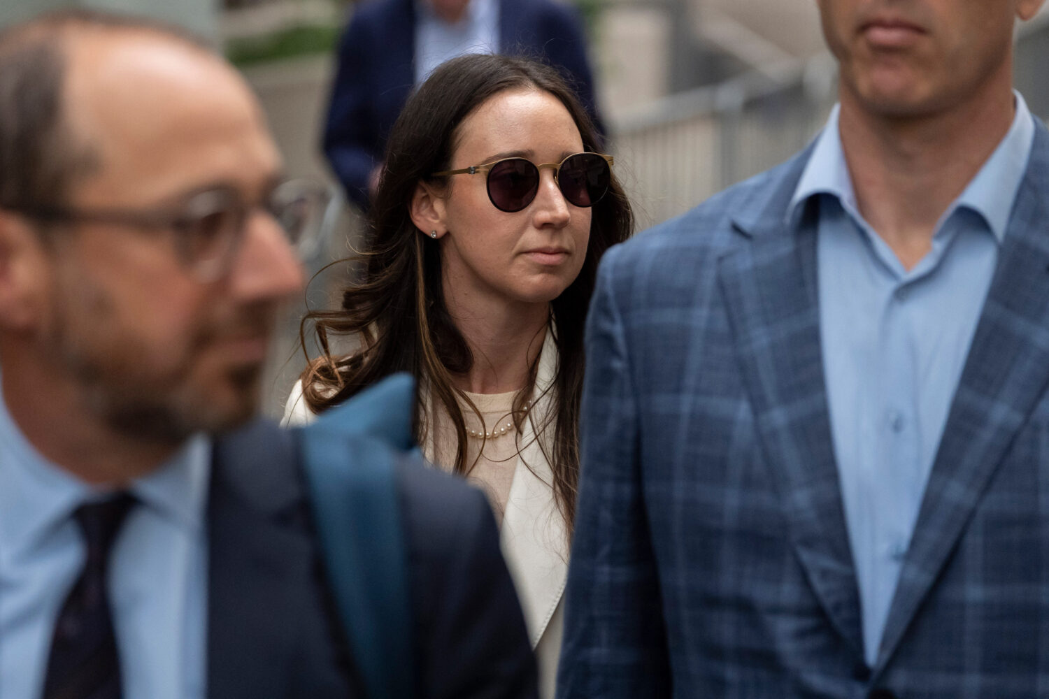 FILE - Charlie Javice, center, exits Manhattan federal court, Sept. 29, 2025, in New York. (AP Phot...