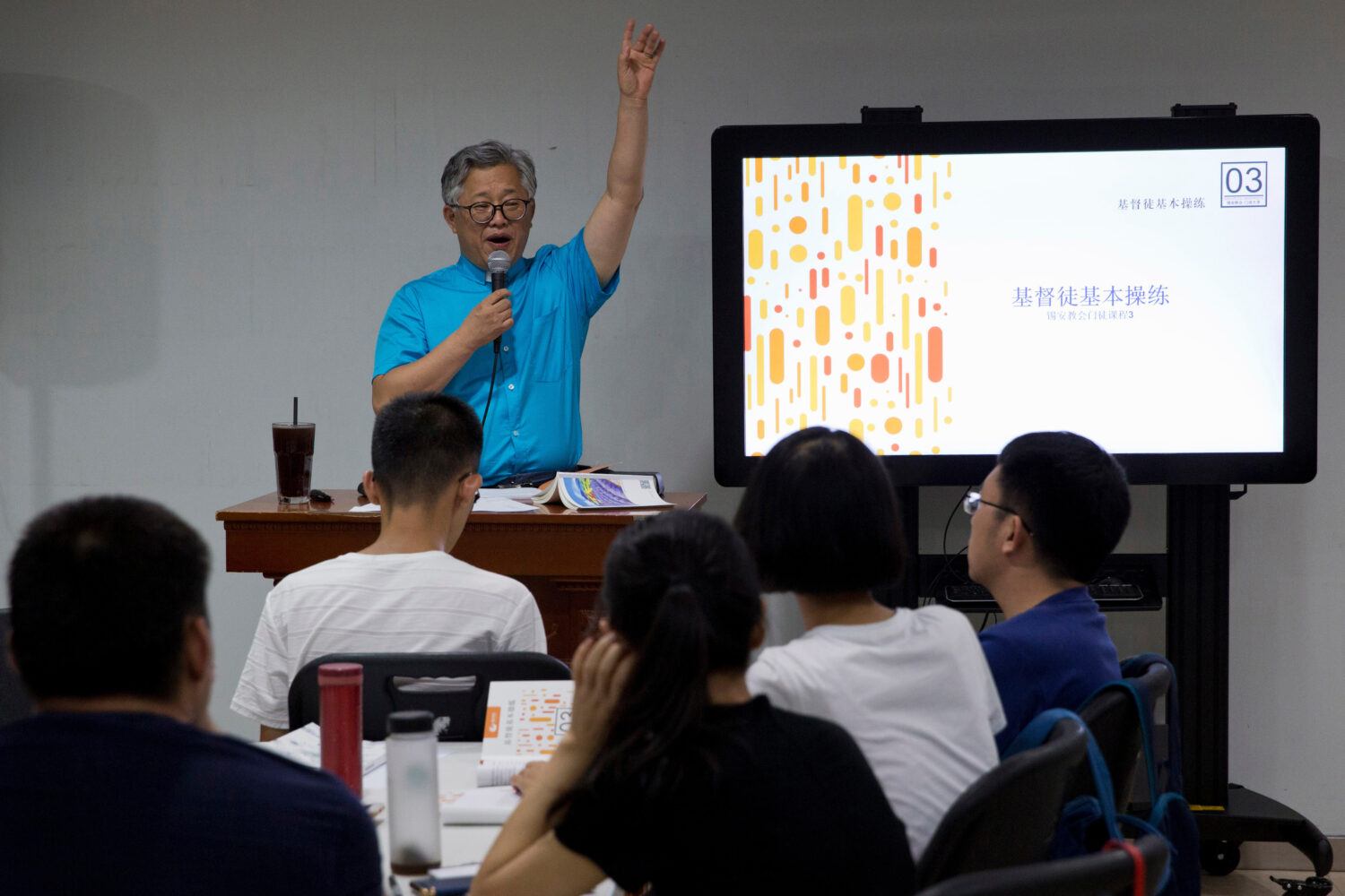 FILE - Pastor Ezra Jin Mingri leads a class on the basics of Christian beliefs at Zion Church in Be...