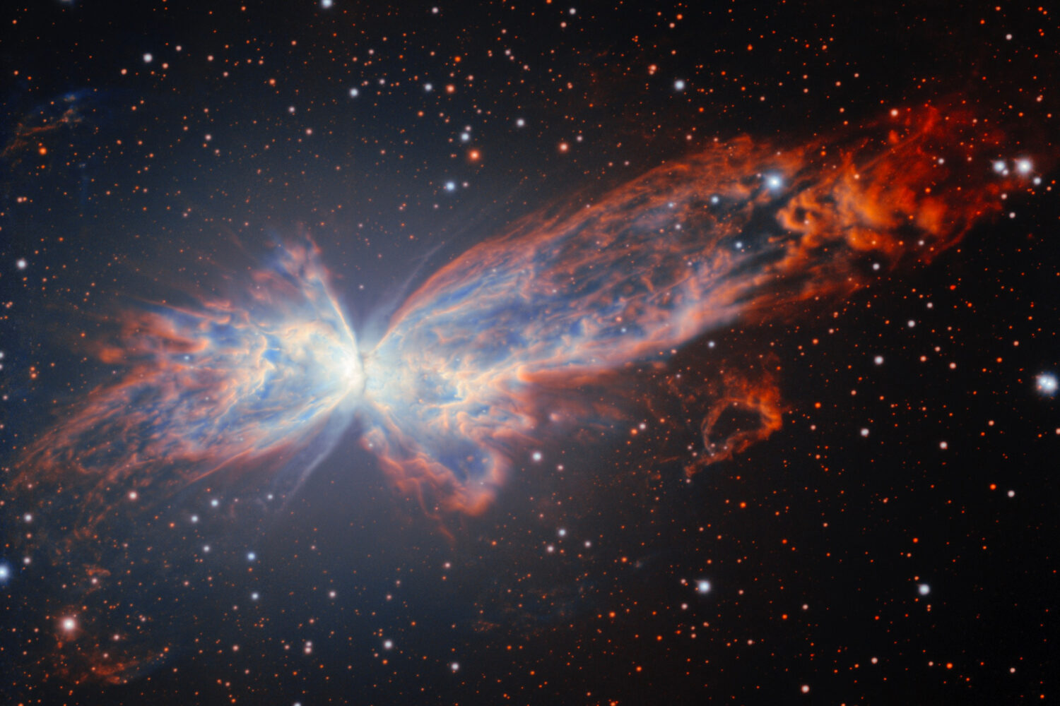 This image provided by NSF NOIRLab shows NGC 6302, a billowing planetary nebula that resembles a co...