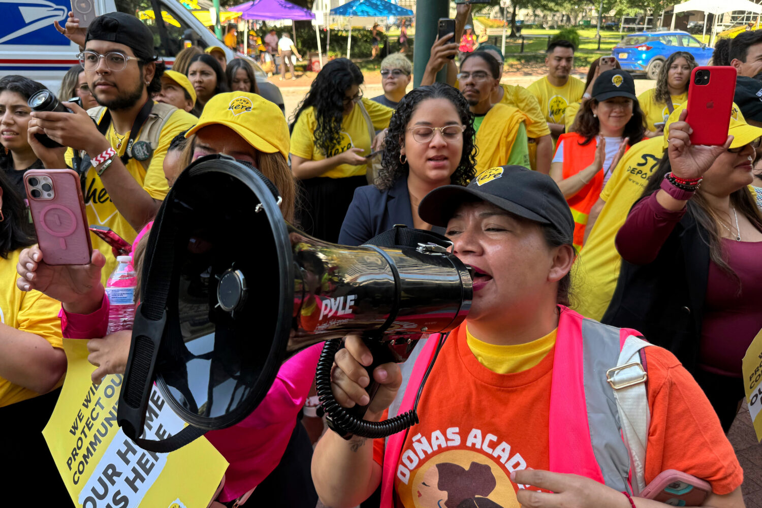 FILE - DACA supporter Claudia Valdivia wields a megaphone at a rally outside federal appeals court ...