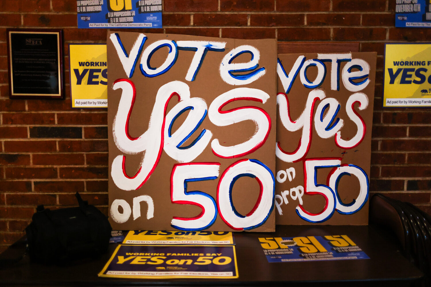 Posters at the IBEW Local 6 headquarters ahead of a campaign event in support of Proposition 50 in ...