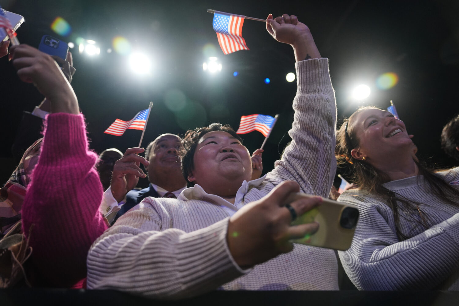 People cheer as Democrat Abigail Spanberger walks out on stage after she was declared the winner of...