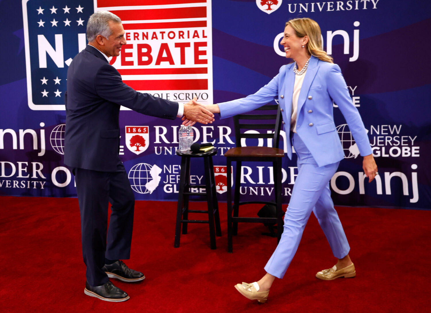 FILE - Republican candidate Jack Ciattarelli, left, shake hands with Democratic candidate for gover...