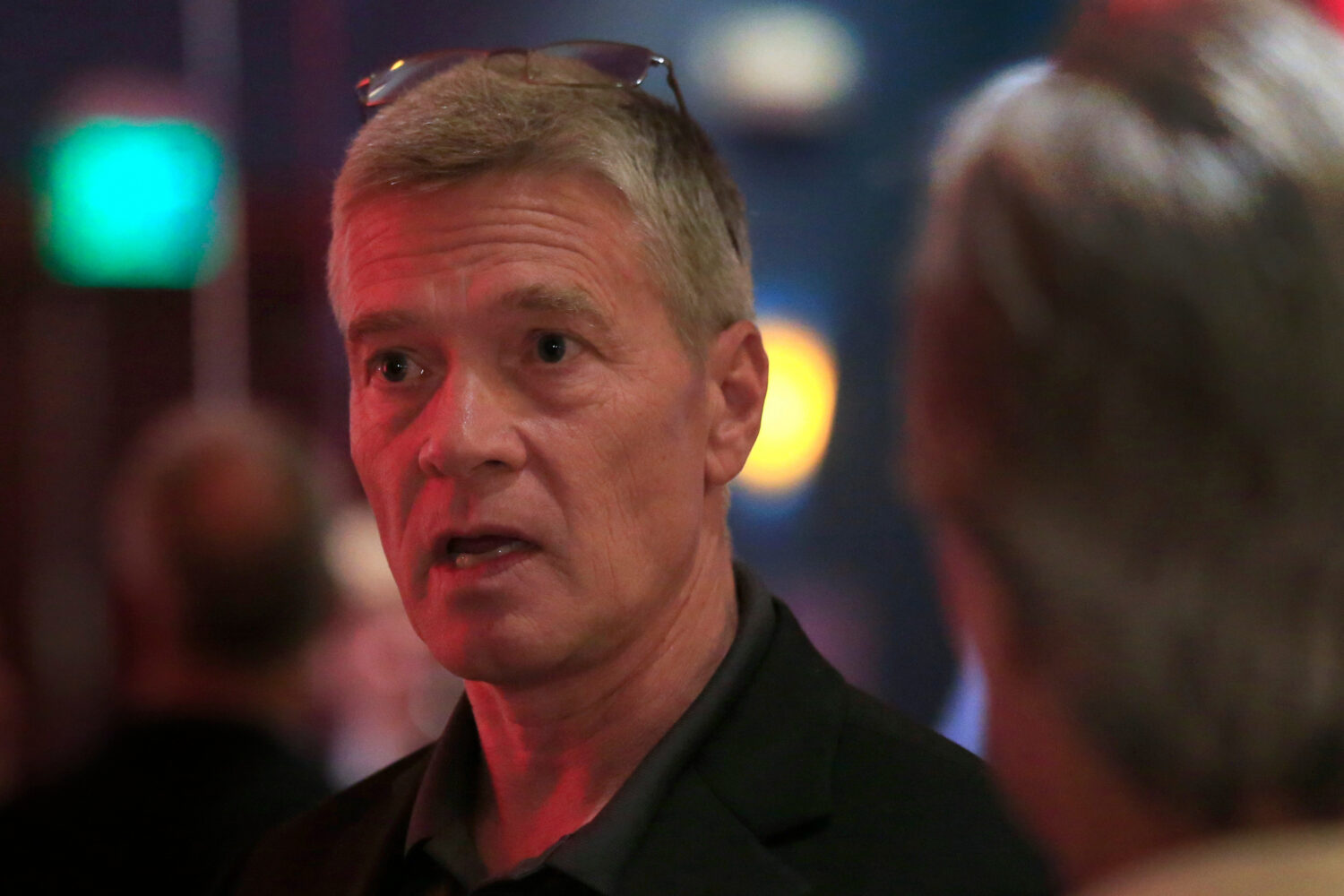 FILE - Republican 3rd district congressional candidate Greg Goode talks with supporters at a Johnso...