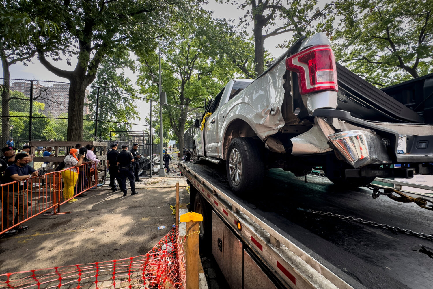 FILE - New York City authorities work a crime scene of a deadly crash Friday, July 5, 2024, in the ...