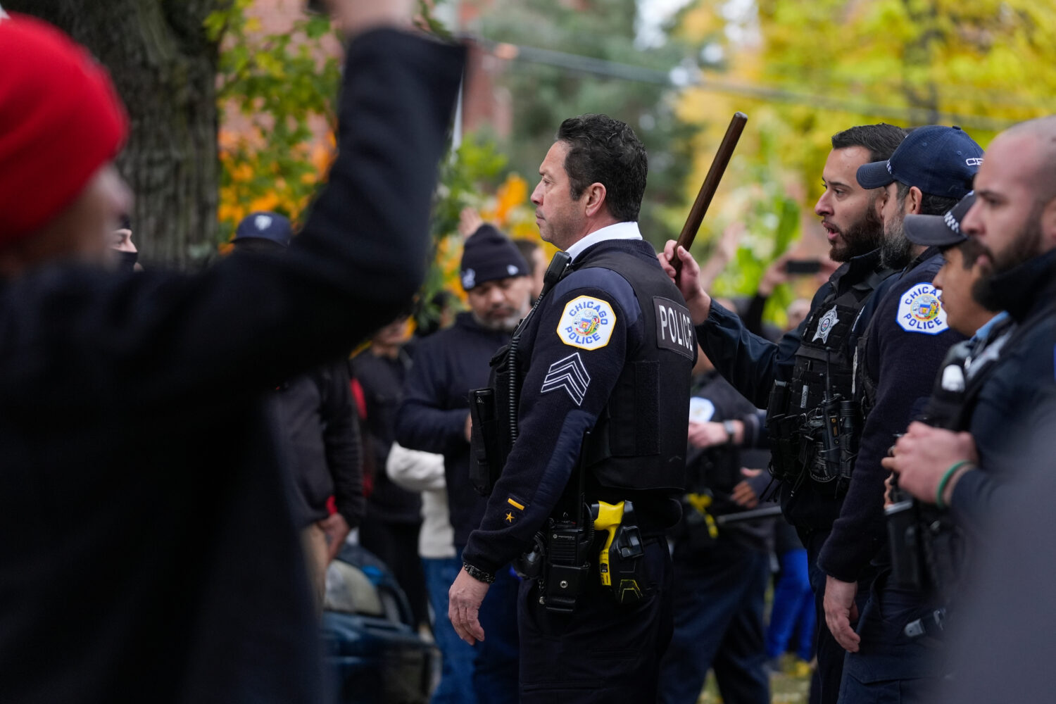 People protesting the actions of federal immigration agents in Little Village clash with Chicago po...