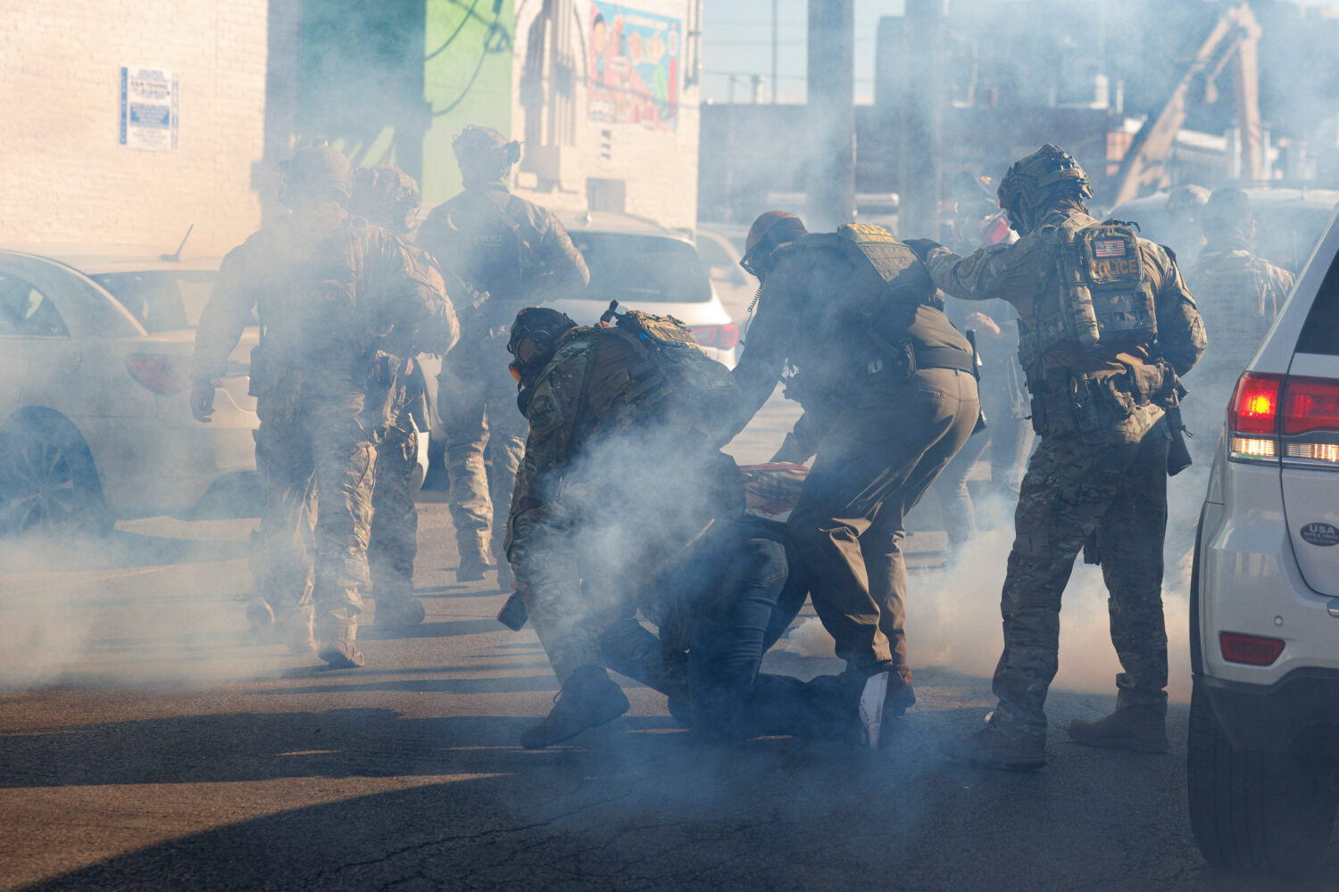FILE - Federal immigration enforcement agents detain a protester in the Little Village neighborhood...