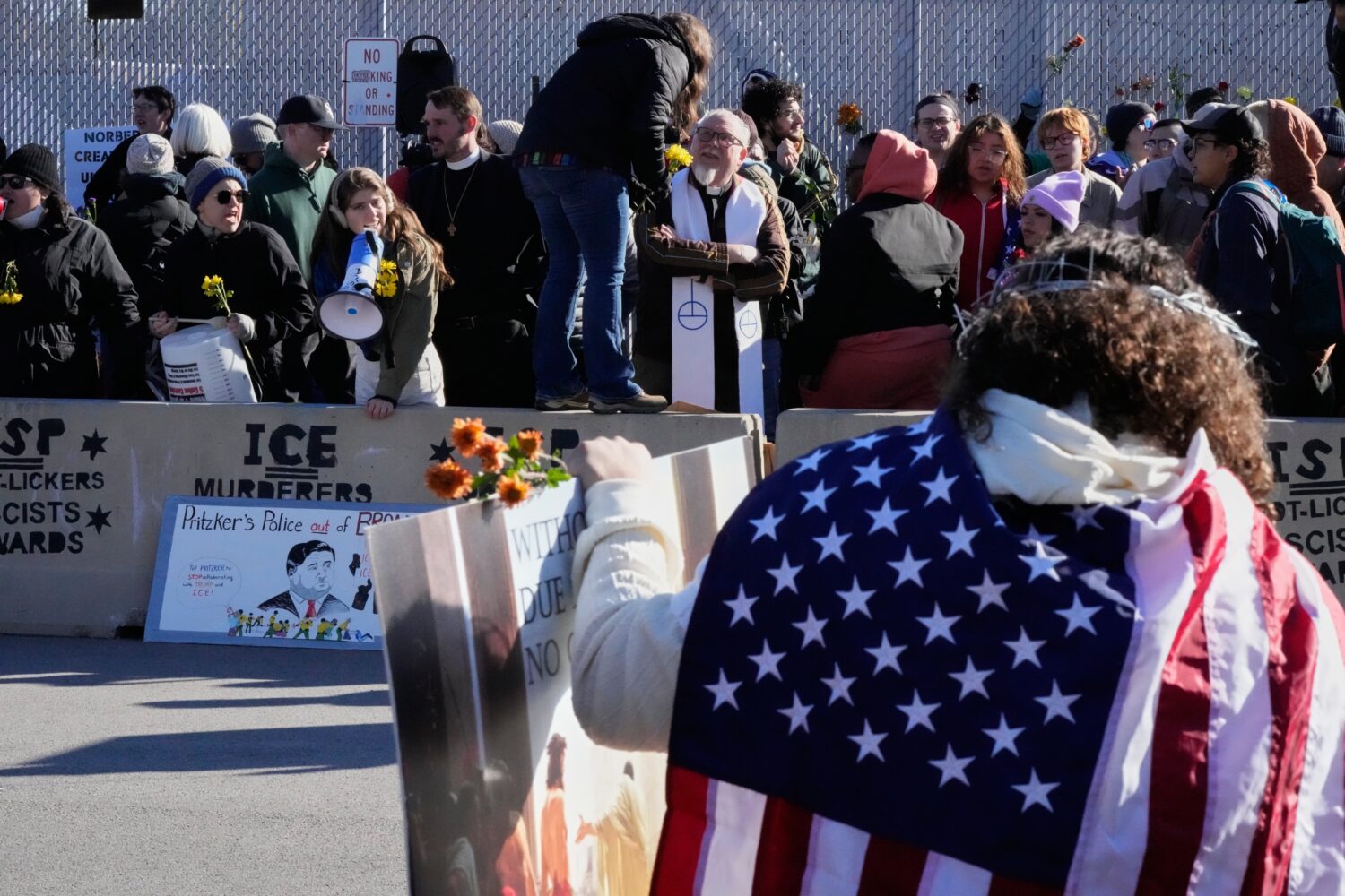 Protesters gather outside an ICE processing facility in Broadview, Ill. a suburb of Chicago, Friday...
