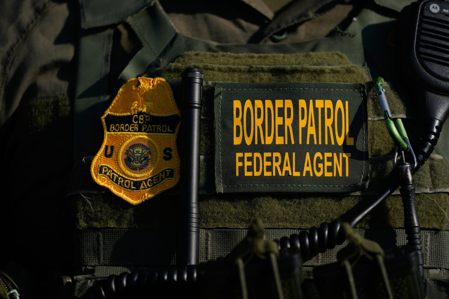 FILE - A Federal Patrol agent's badge is seen near an Immigration and Customs Enforcement facility ...