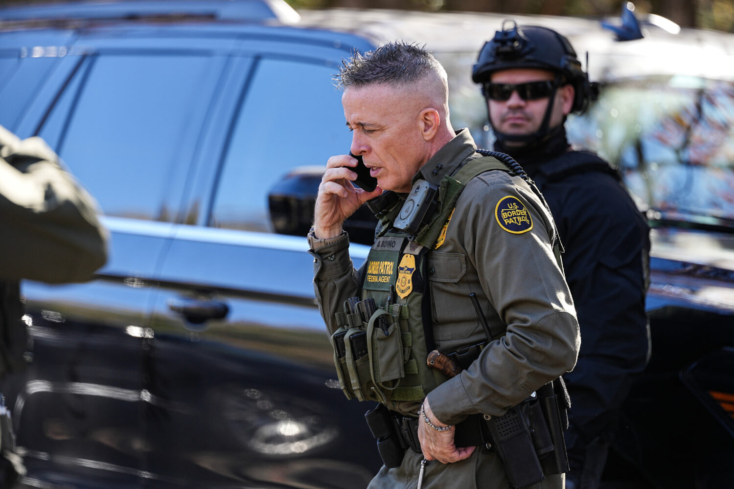 U.S. Border Patrol Commander at large Gregory Bovino takes a phone call, Monday, Nov. 17, 2025, in ...