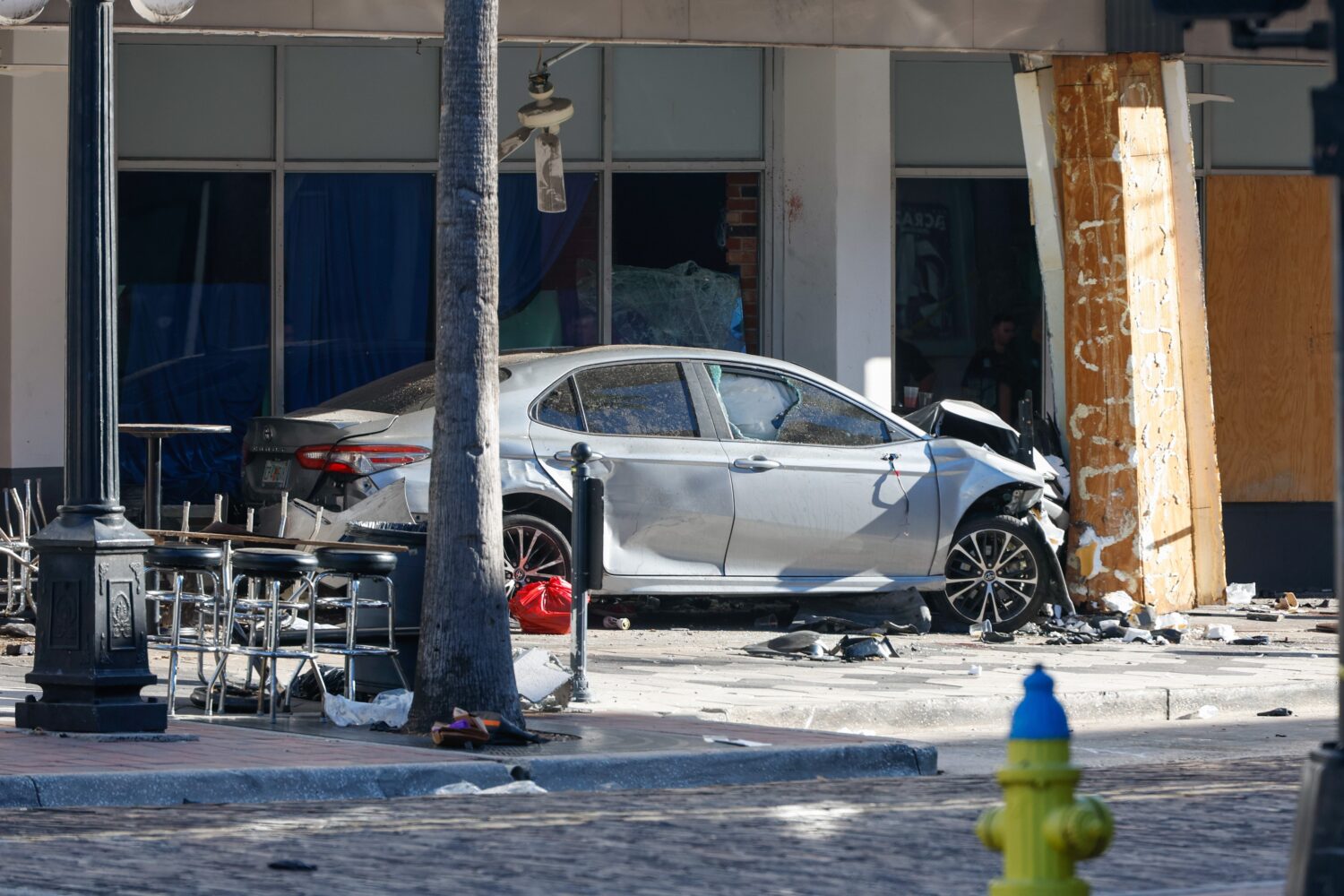 A car that crashed into a local business is shown on Saturday, Nov. 8, 2025, in Tampa, Fla. (Jeffer...