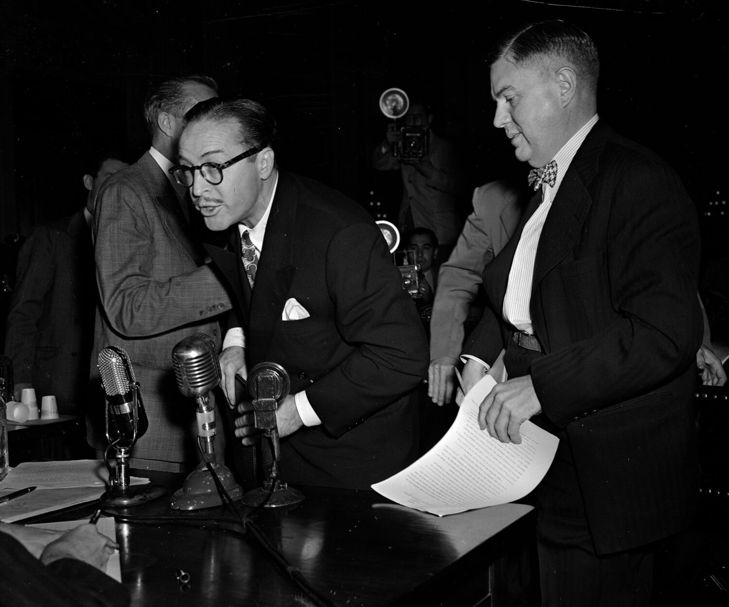FILE - Dalton Trumbo, left, Hollywood screenwriter, shouts from the witness stand as he tries to ma...