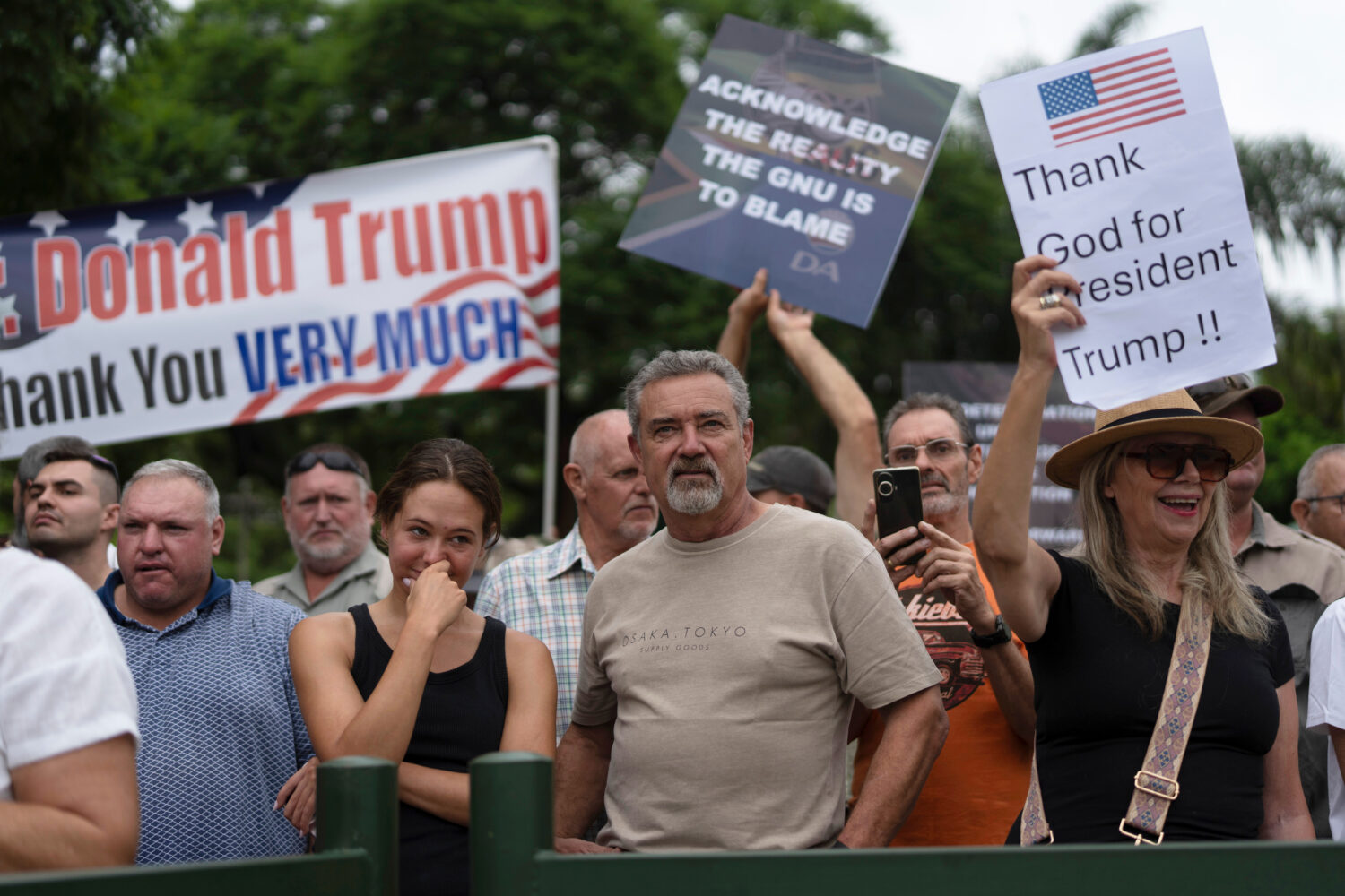 FILE - White South Africans demonstrate in support of U.S. President Donald Trump in front of the U...