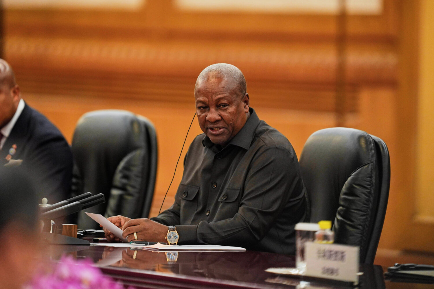 FILE - Ghana's President John Mahama speaks during a meeting with Chinese President Xi Jinping, uns...