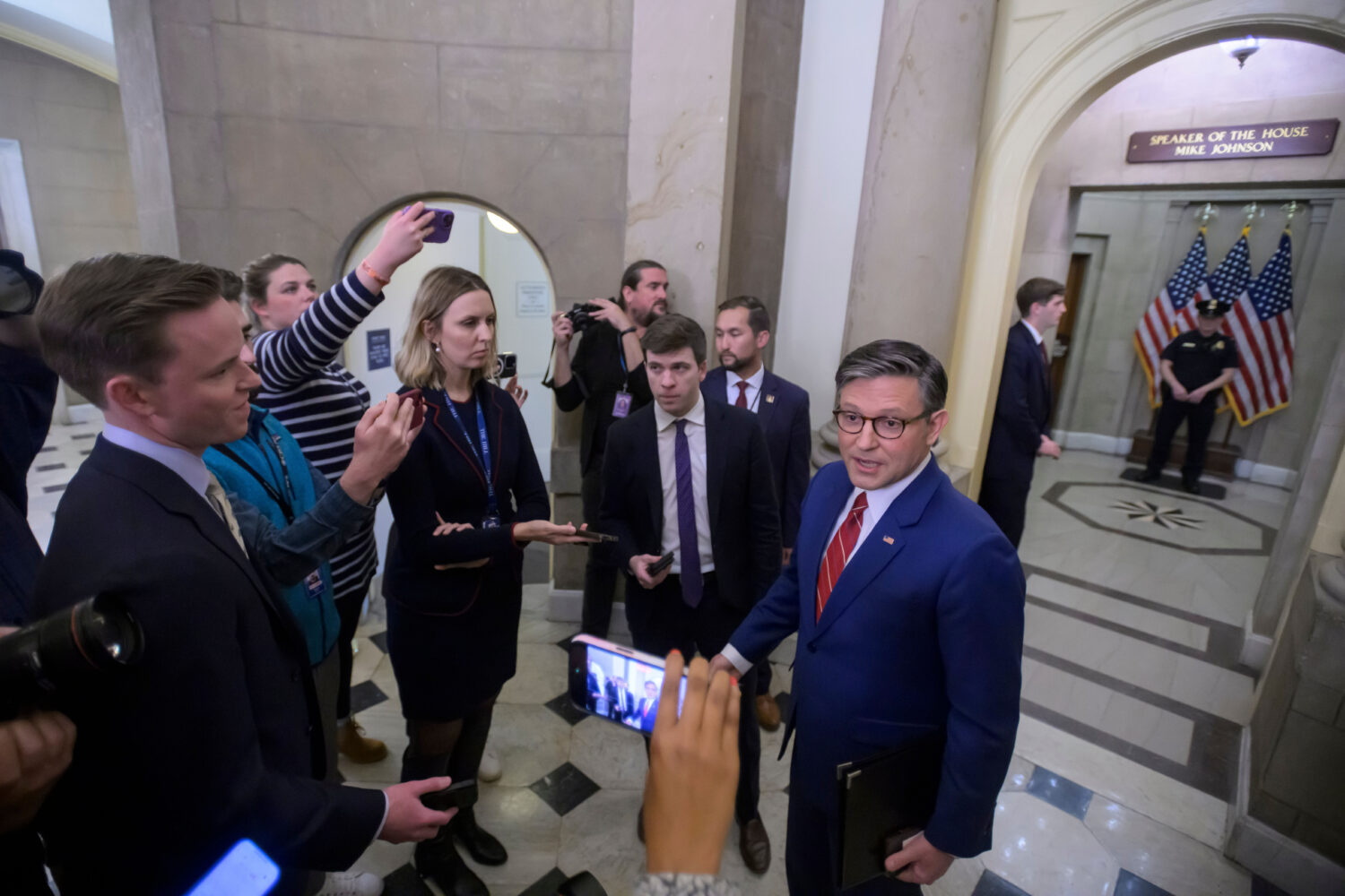 Speaker of the House Mike Johnson, R-La., talks with reporters outside his office at the U.S. Capit...