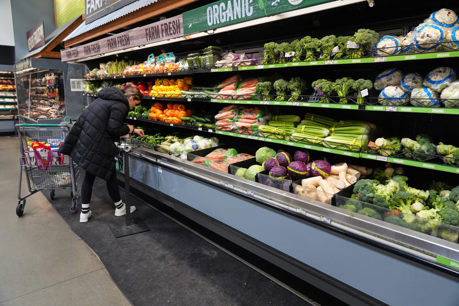 A person shops for produce, which is covered by the USDA Supplemental Nutrition Assistance Program ...