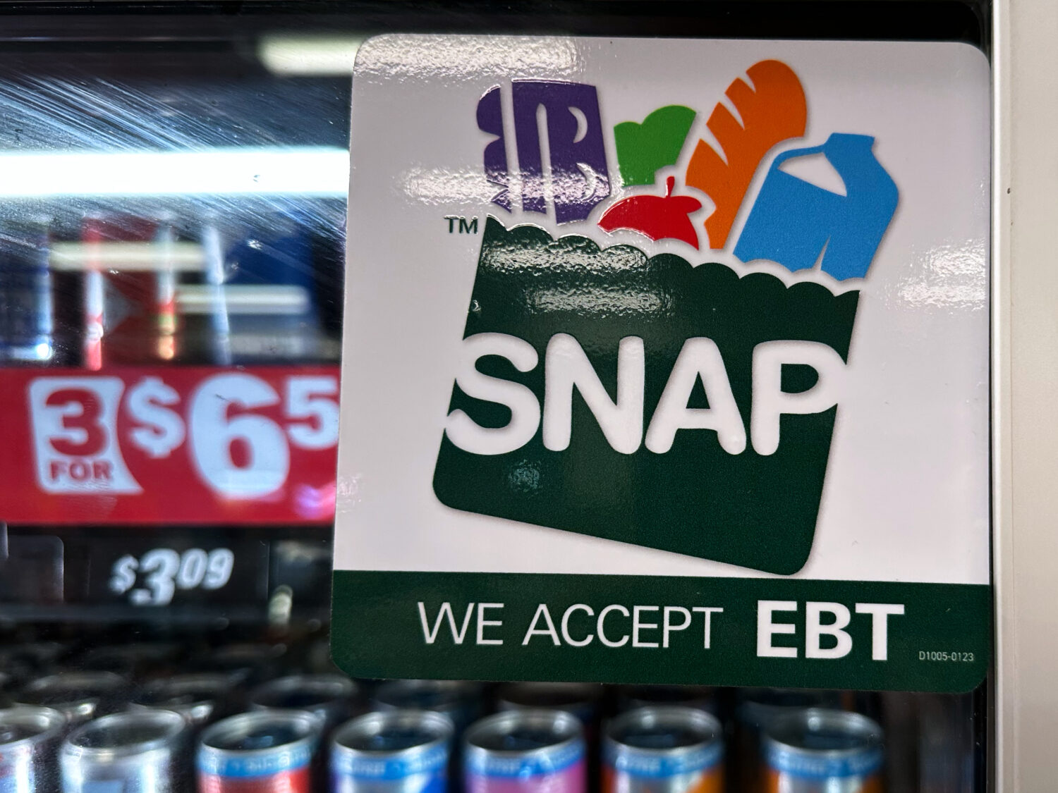 FILE - SNAP EBT information sign is displayed at a gas station in Riverwoods, Ill., Saturday, Nov. ...