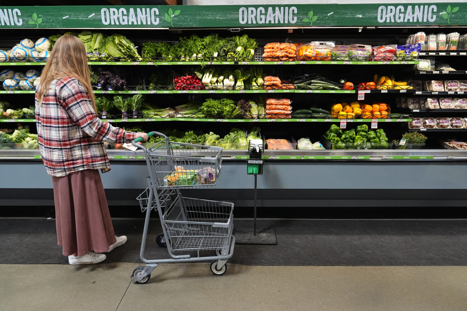 A person shops for produce, which is covered by the USDA Supplemental Nutrition Assistance Program ...