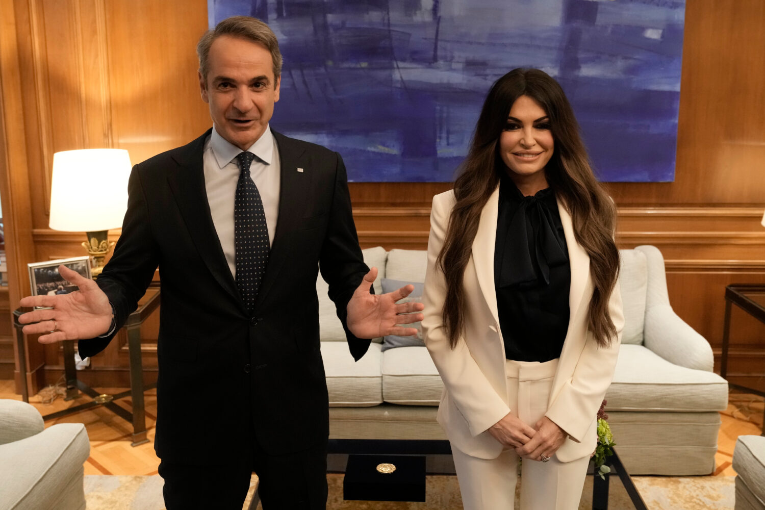 Greece's Prime Minister Kyriakos Mitsotakis, left, welcomes Kimberly Guilfoyle, the new U.S. Ambass...