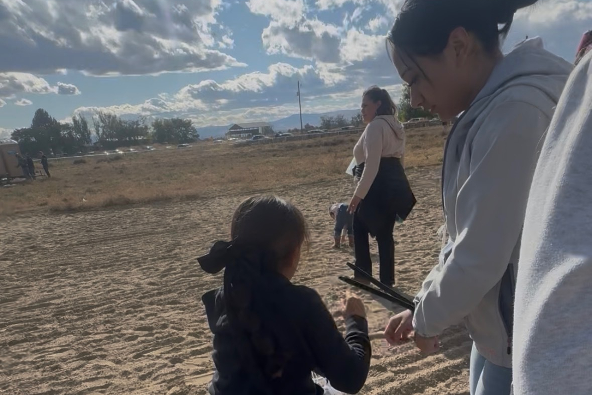 This photo provided by Anabel Romero shows her 14-year-old daughter, right, with her hands zip-tied...