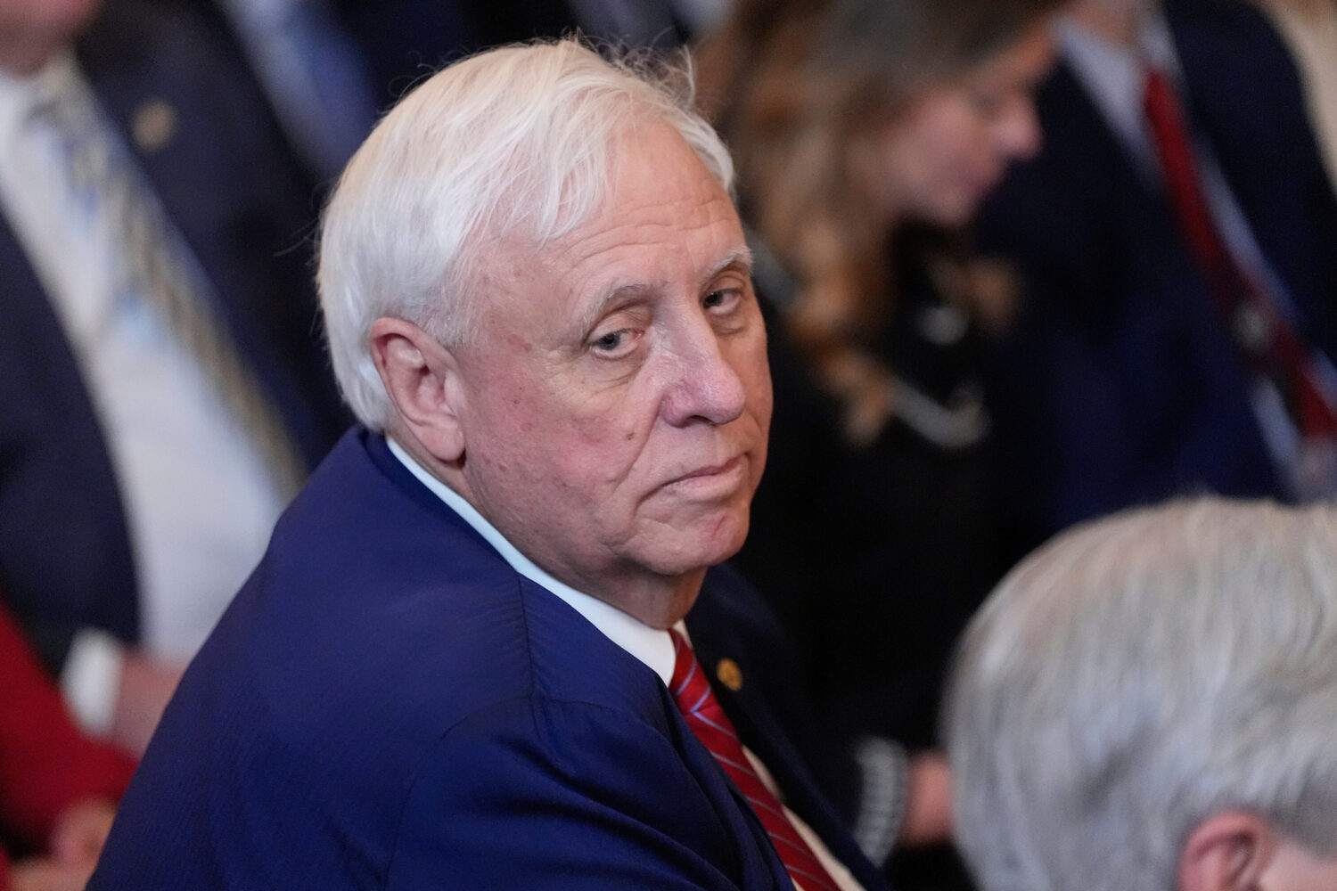FILE - Sen. Jim Justice, R-W.Va., listens as President Donald Trump speaks during an event on energ...