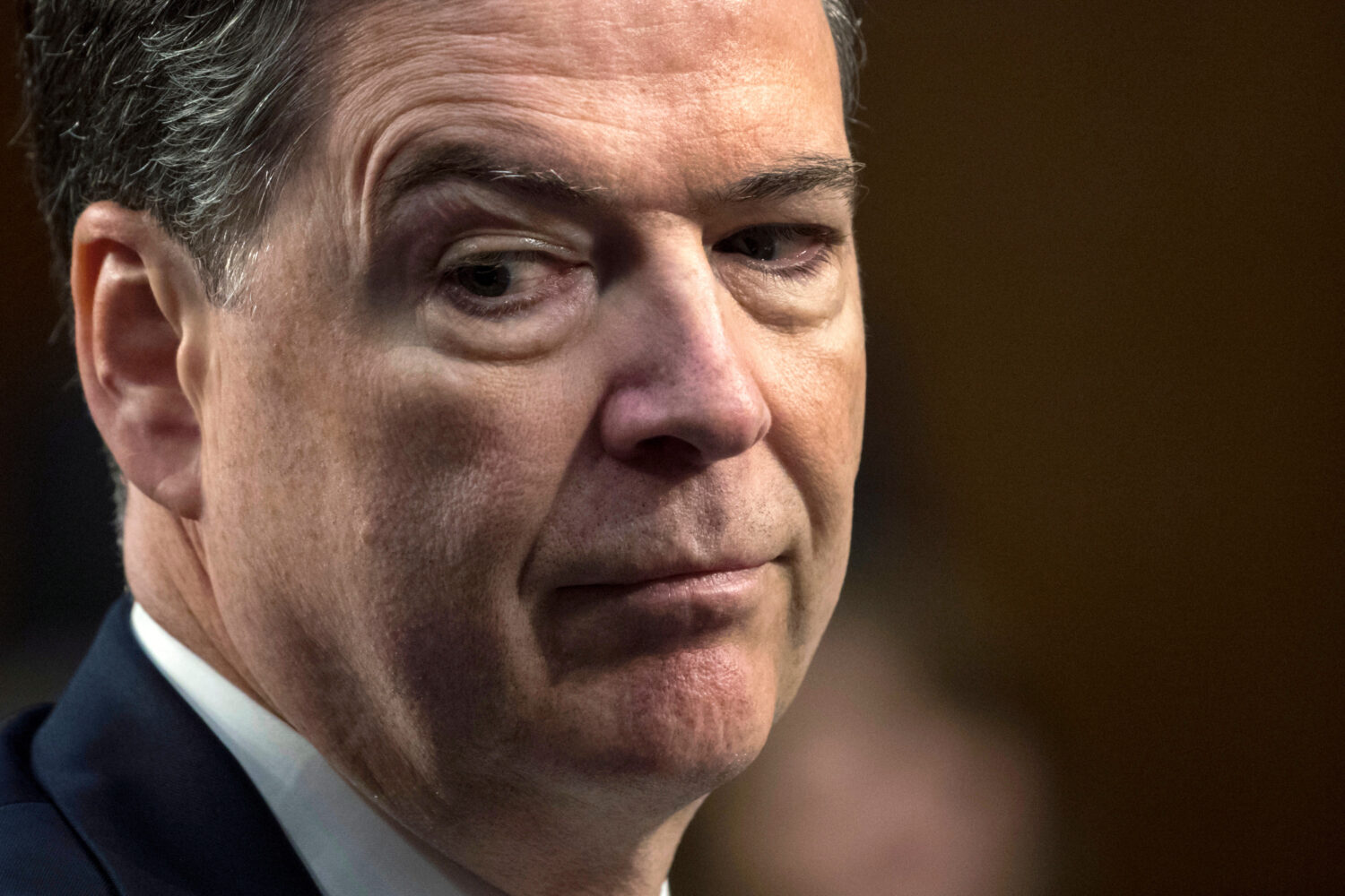 FILE - Former FBI Director James Comey testifies before the Senate Select Committee on Intelligence...