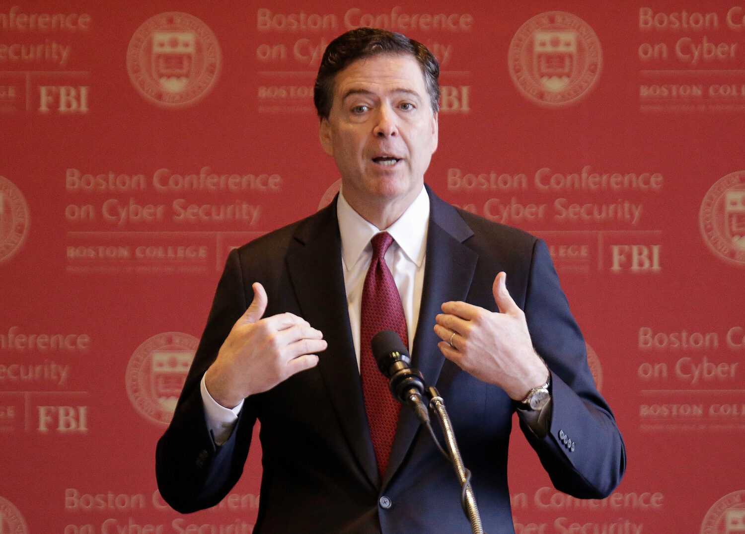 FILE - FBI Director James Comey gestures as he speaks on cyber security at the first Boston Confere...