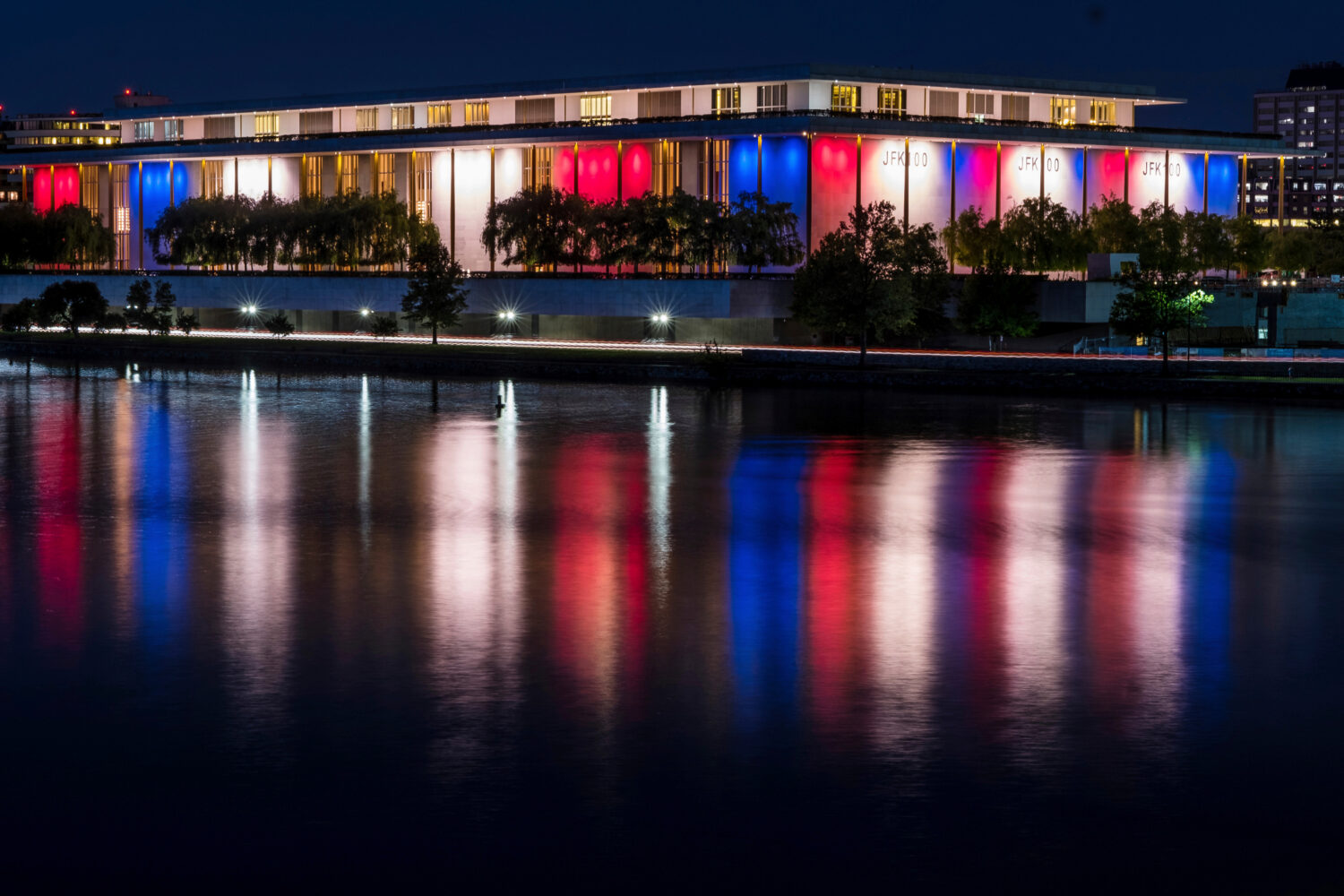 FILE - The red, white and blue lights, marking the 100th birthday of President John F. Kennedy, on ...