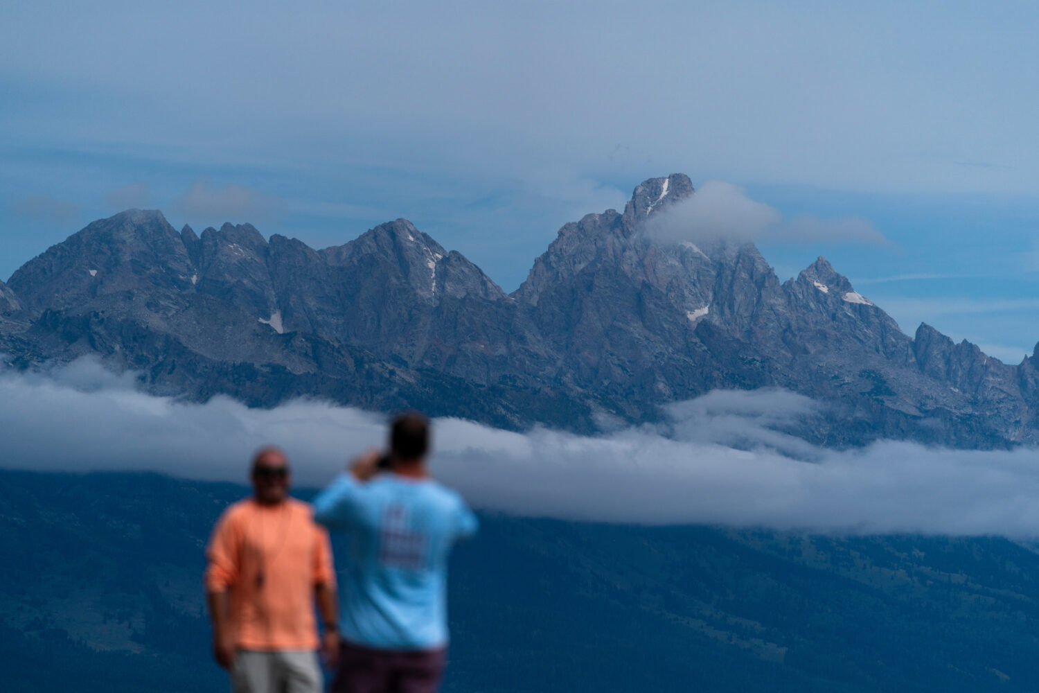 FILE - Tourists take photos in Grand Teton National Park, Wyo., Aug. 14, 2022. (AP Photo/Jae C. Hon...