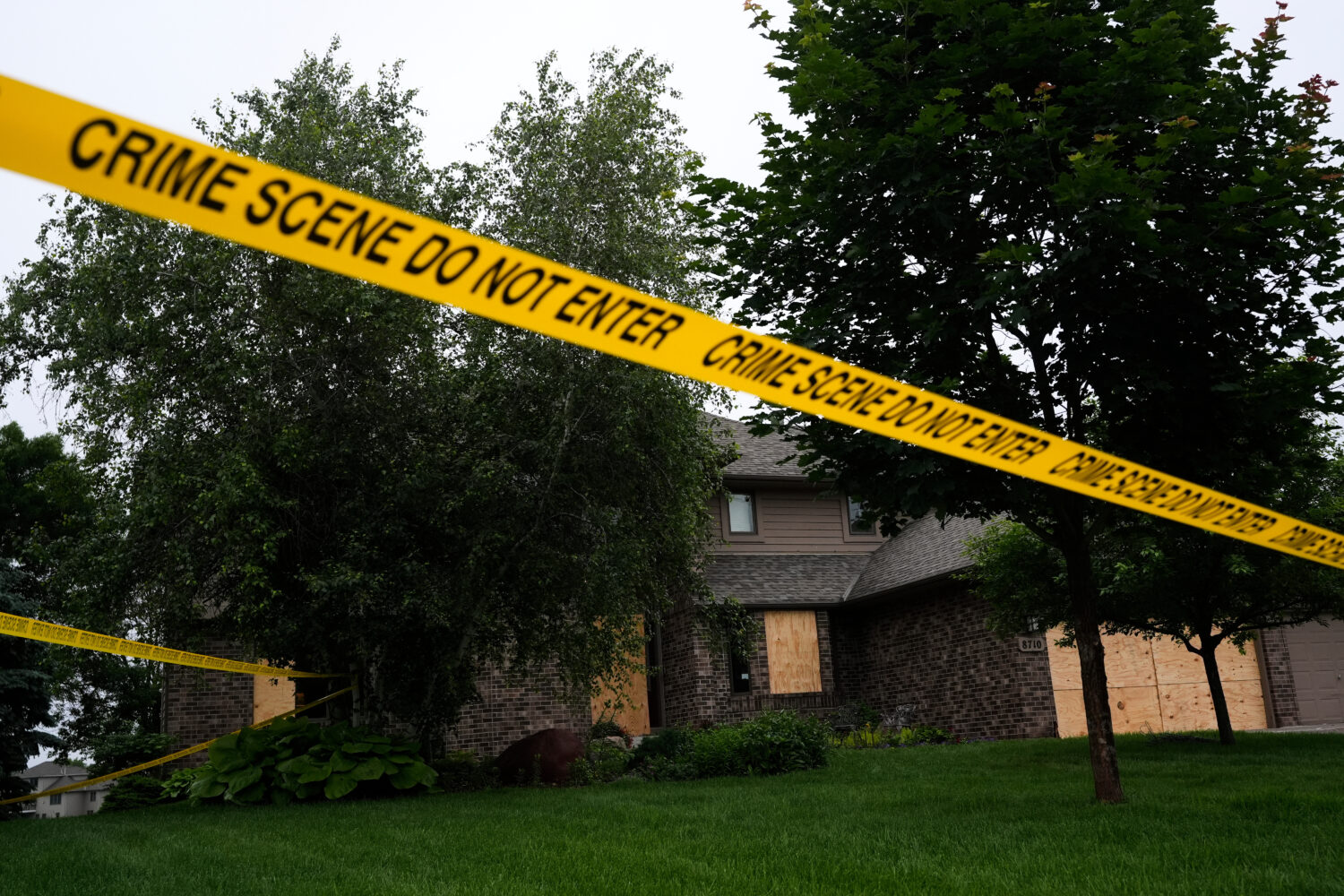 FILE - Police tape blocks off the home of Minnesota state Rep. Melissa Hortman, Sunday, June 15, 20...