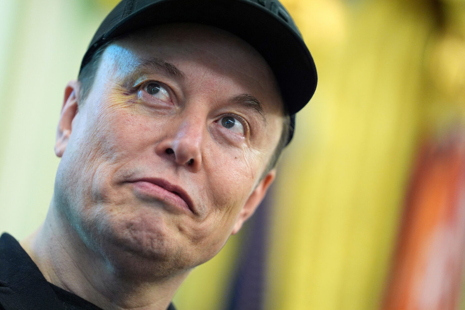 FILE - Elon Musk listens as President Donald Trump speaks during a news conference in the Oval Offi...