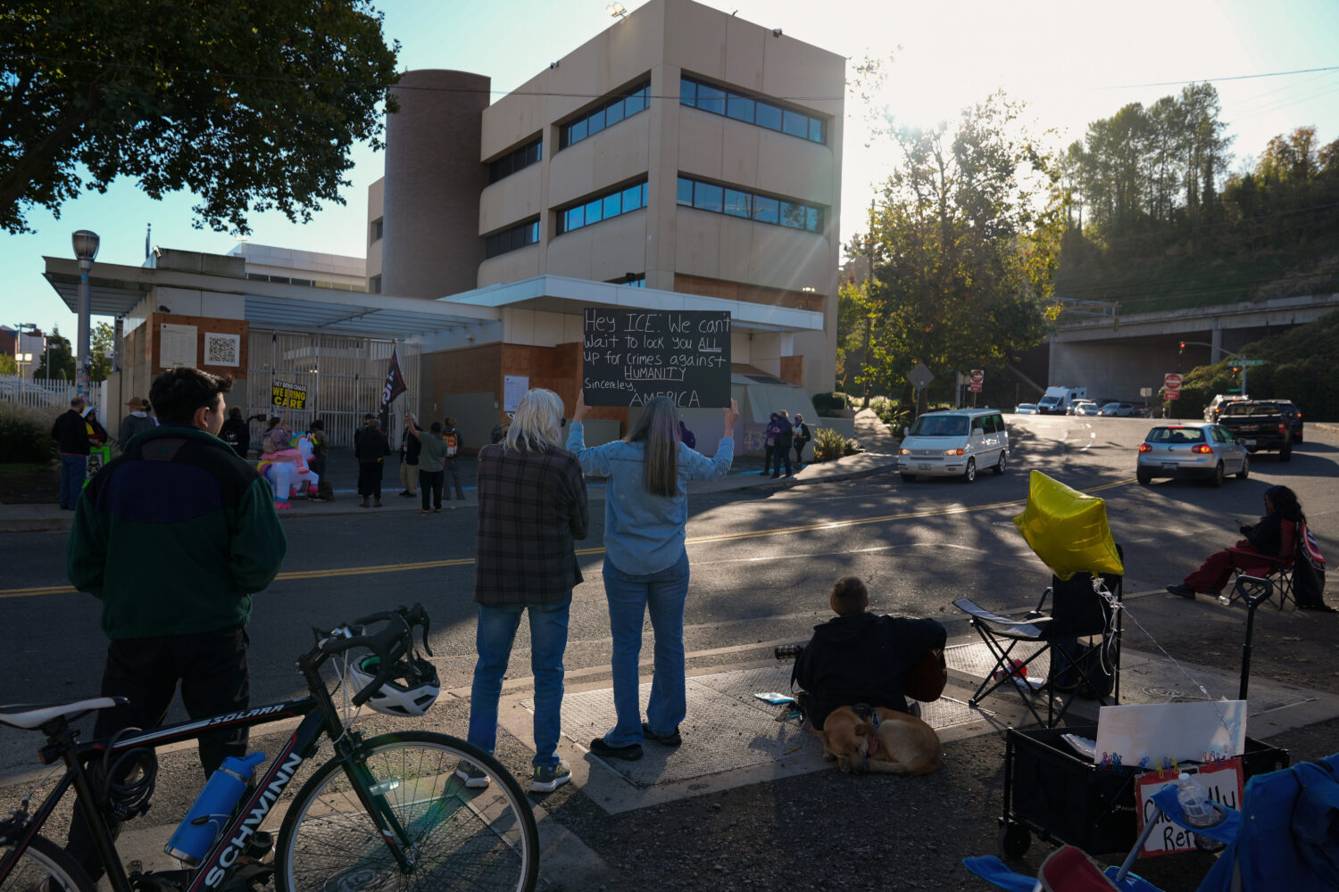 People protest outside a United States Immigration and Customs Enforcement (ICE) facility in Portla...