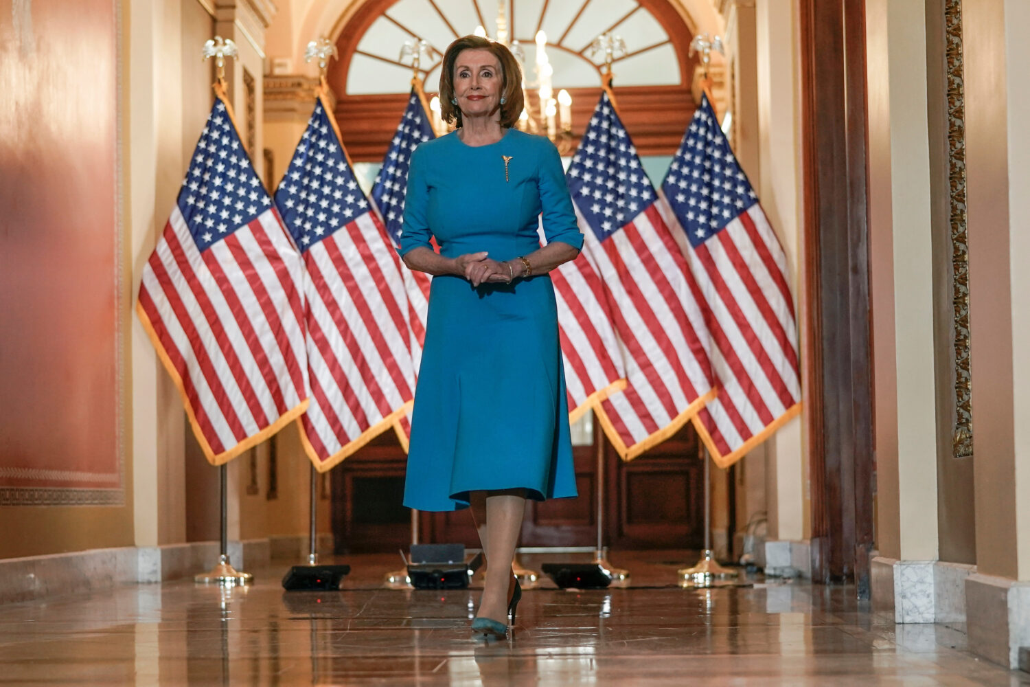FILE - House Speaker Nancy Pelosi of Calif., arrives to speak about the House coronavirus bill on C...