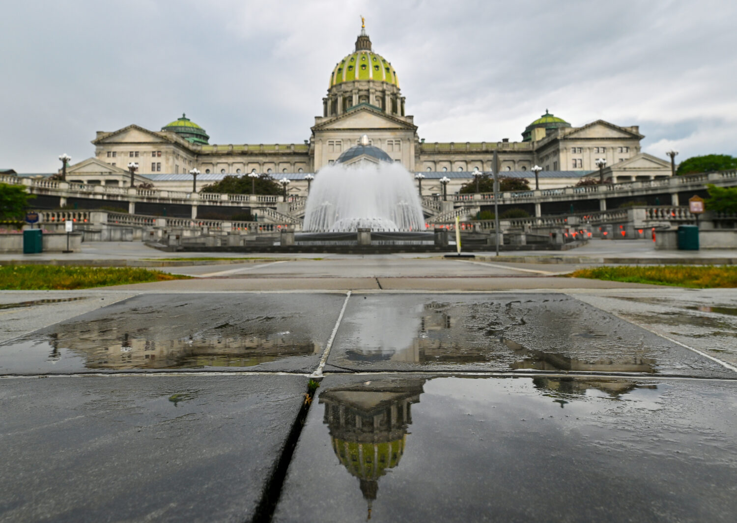FILE - The Pennsylvania State Capitol is reflected on the ground June 30, 2025, in Harrisburg, Pa. ...