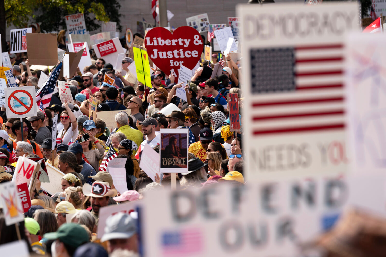 FILE - Demonstrators rally on Pennsylvania Avenue during a No Kings protest in Washington, Oct. 18,...